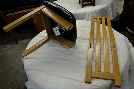 A chair frame taken apart in the workshop for repair