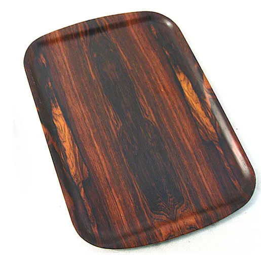 A rosewood tray with a dark figured grain